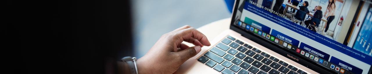 Person using a laptop up close